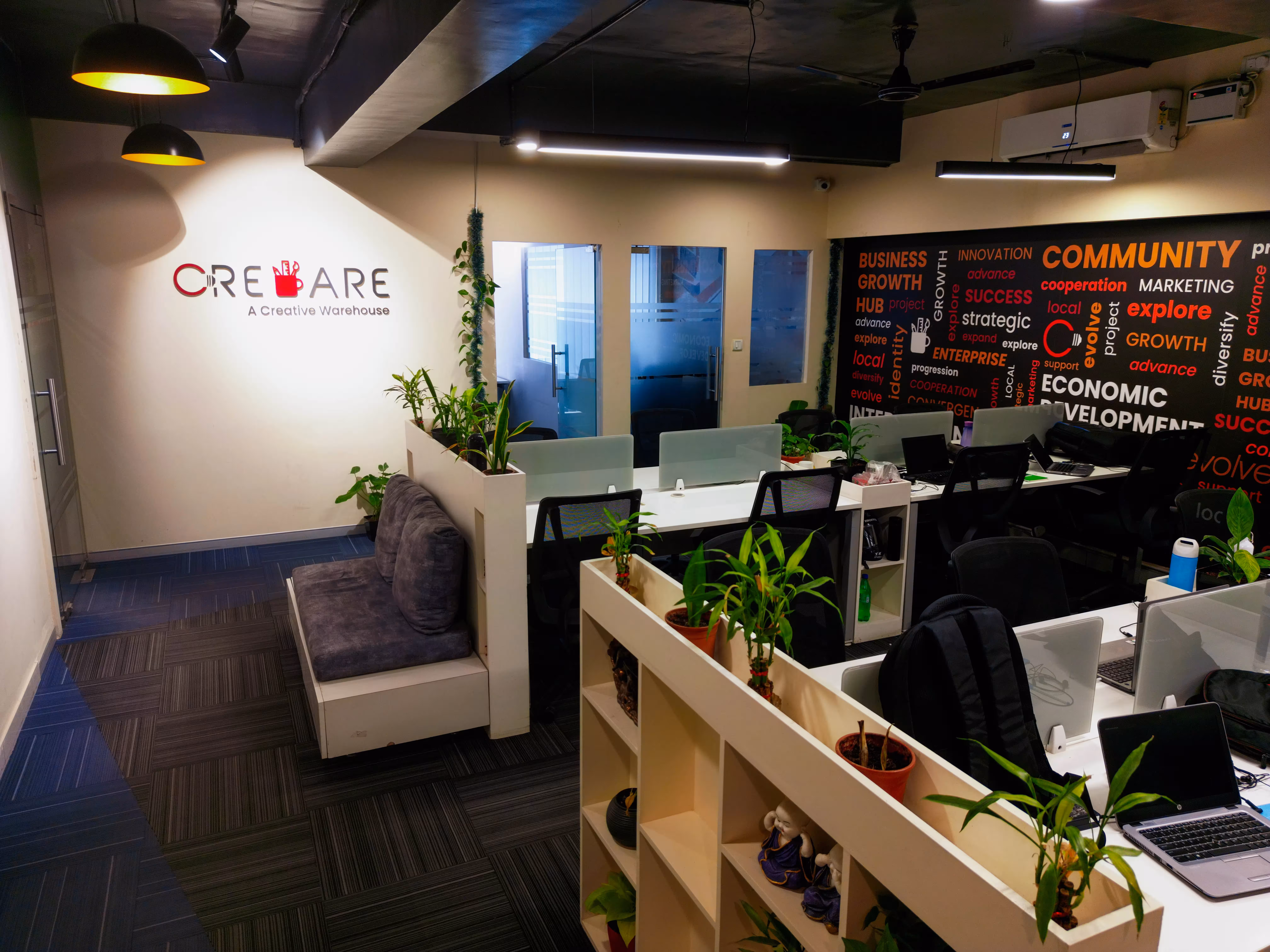 Creware logo wall with open workspace at Bangalore
