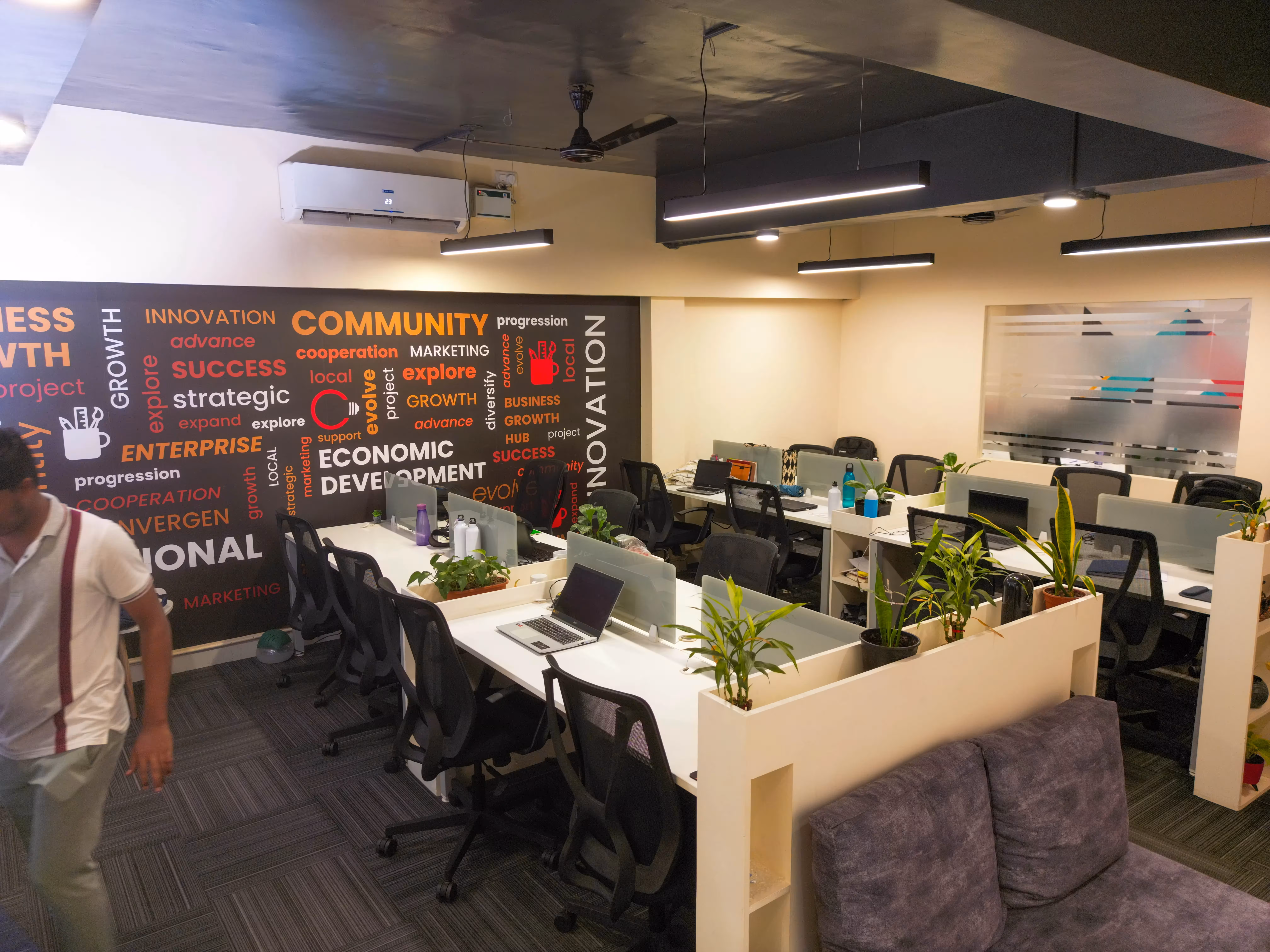 Wide open workspace with community mural at Bangalore