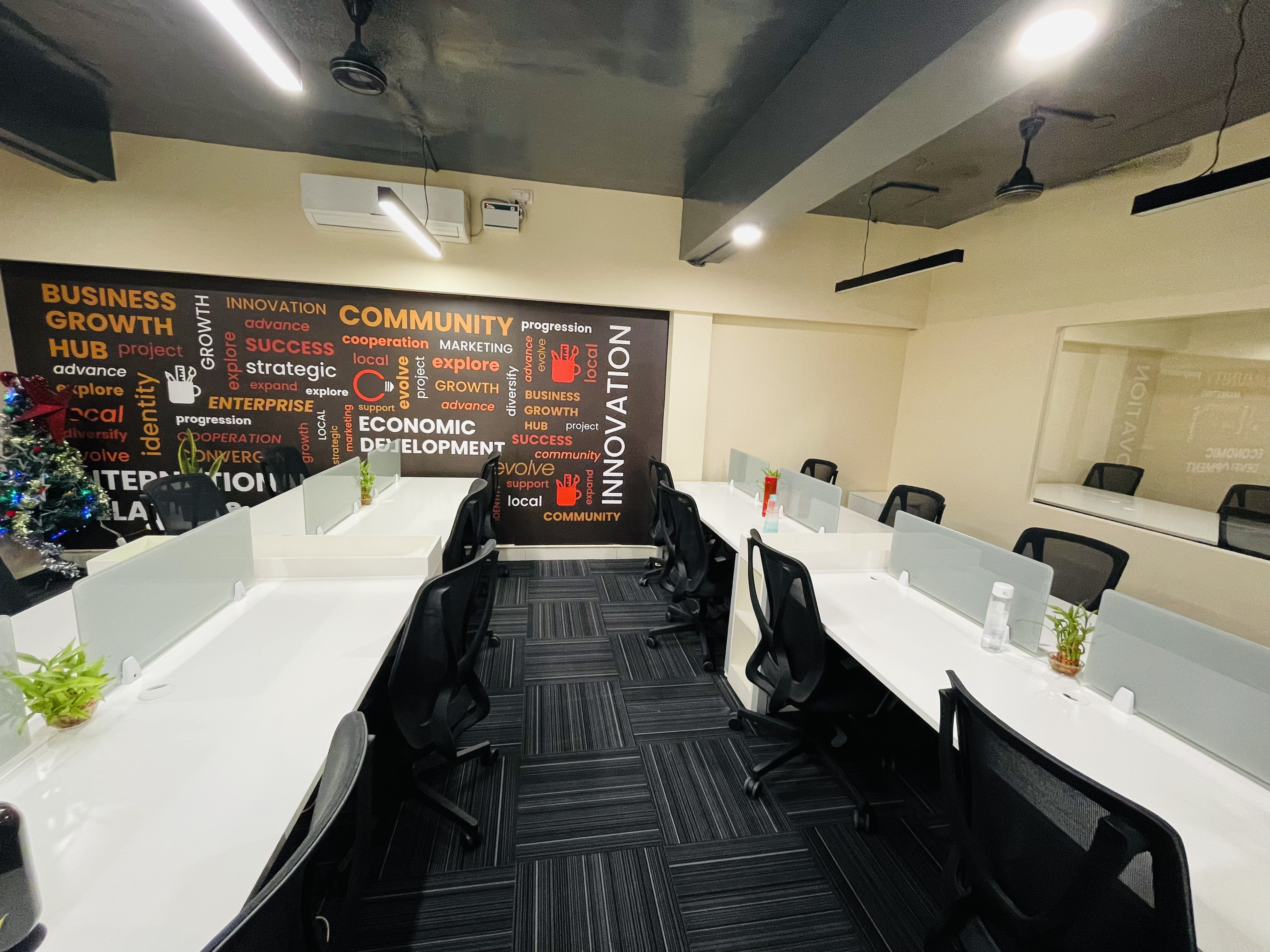 Dedicated desks with community mural wall